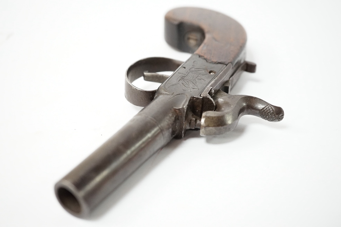 A boxlock percussion pocket pistol, London proved, with turn off barrel, frame signed Whalley within oval upon flag trophy, sliding top thumb safety, slab walnut grip. Condition - fair to good.